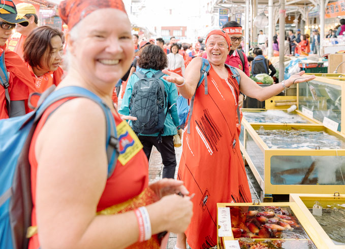 Foreign tourists enjoying the fish market